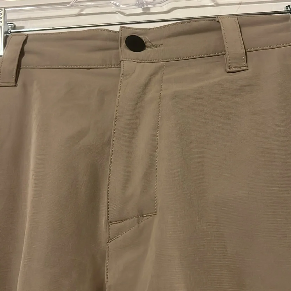 Banana Republic flat front tan shorts. Back elastic waist for comfort.